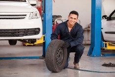 Mechanic with Tire